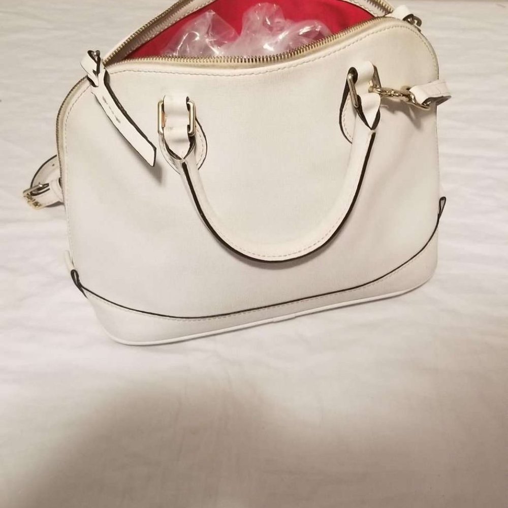 Women's white handbag with red interior